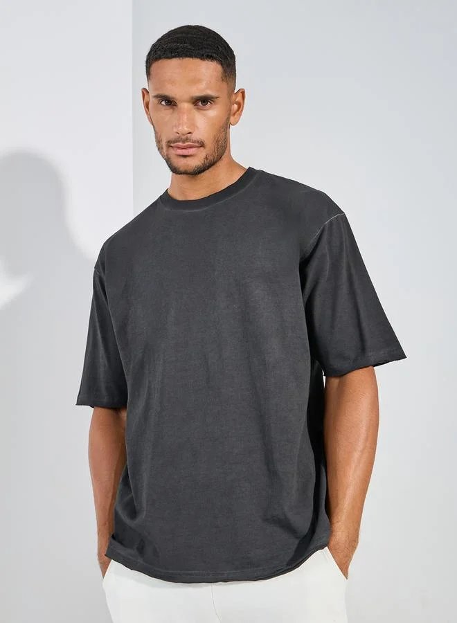Styli Overdyed Washed Oversized T-Shirt with Raw Edge Sleeve